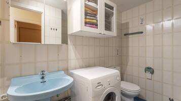 Bathtub, hair dryer, towels