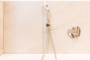 Bathtub, hair dryer, towels