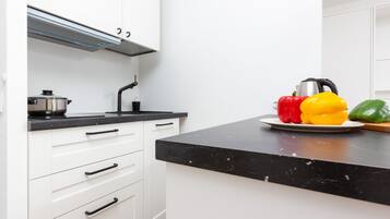 Fridge, microwave, stovetop, coffee/tea maker