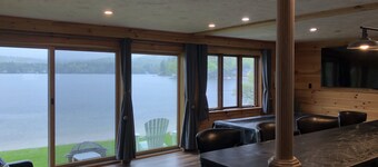 A quiet cove, the sunset and a sandy beach, on Lake Winnipesaukee