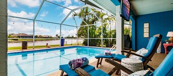 Sunny Waterfront Oasis: Your Dream Pool Home with Southern Exposure