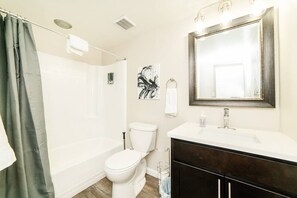 Bathtub, hair dryer, towels