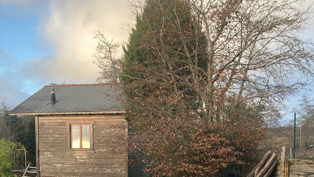 A wooden house with a blue swimming pool in front. - Superb character house entirely renovated for your pleasure. (Monthermé)