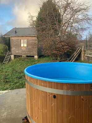 A wooden house with a blue swimming pool in front. - A superb, characterful home, completely renovated for your enjoyment. (Monthermé)