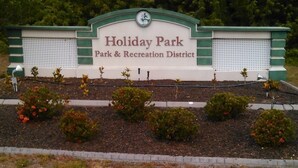 Naamplaatje voor Vakantiepark, met vermelding dat het deel uitmaakt van het Park- en recreatiegebied.