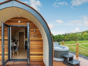 A cozy wooden cabin with a sign reading "BEECH" and a hot tub on the deck. - 1 bedroom accommodation in Llanfair Caereinion (Llanfair Caereinion)