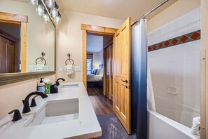 Combined shower/tub, hair dryer, towels, soap