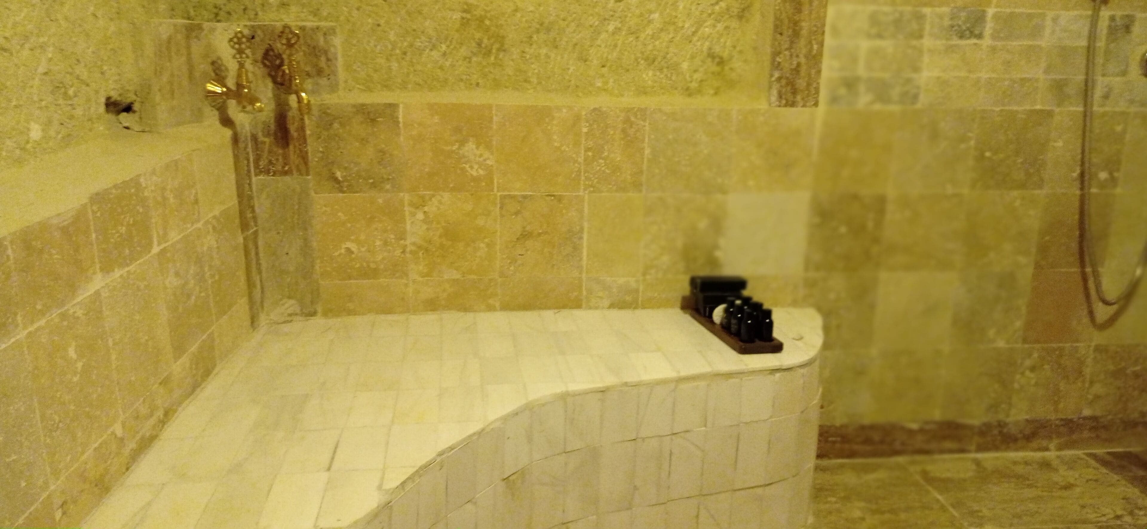 A bathroom with a bathtub, a shower, and a sink.