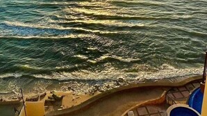 A sunset over the ocean with a beach and a pool area. - BEACHFRONT 2 BEDROOM CONDO IN LAS GAVIAS RESORT - Sleeps 6 (Mazatlán)