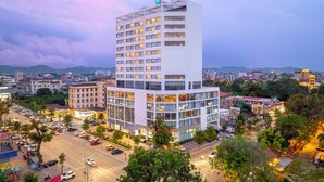 A modern hotel with multiple floors, large windows, and a prominent rooftop sign. - Tru by Hilton Bac Giang City Centre (Bac Giang)