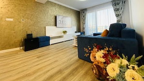 Family Apartment | Living area | 110-inch LED TV with digital channels, TV, Netflix - Charming Flat with Balcony & Parking (Craiova)