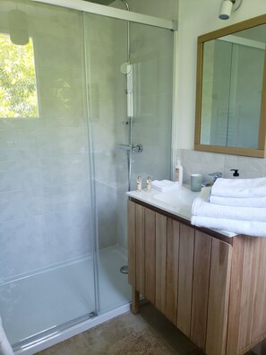 Shower, hair dryer, towels, toilet paper