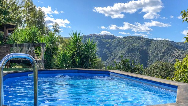 A swimming pool with a view of a mountainous landscape. - Stunning home in Ficarra (Ficarra)
