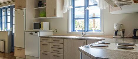 Fridge, stovetop, dishwasher, coffee/tea maker