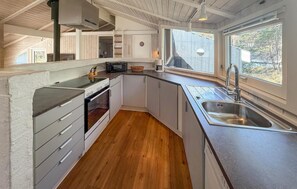 Fridge, stovetop, dishwasher, coffee/tea maker