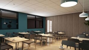 A modern dining area with multiple tables and chairs, large windows, and pendant lighting. - Shell Cangzhou Nanpi County Hospital of Traditional Chinese Medicine Hotel (Cangzhou)
