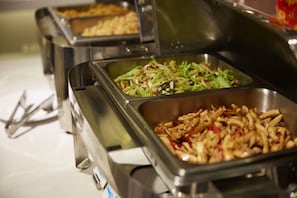 A buffet with various food options including salads and stir-fried dishes. - Echarm Hotel Jingmen Intime City (Jingmen)
