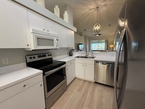 Fridge, microwave, oven, stovetop - Gorgeous Newly Furnished Condo in Gated Golf Course of Stoneybrook (Estero)