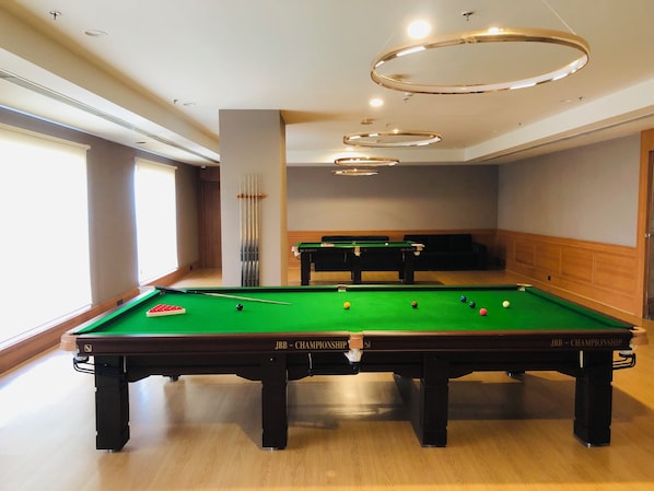 Enjoy a game of pool in our well-equipped room with a professional-grade table and ample lighting.