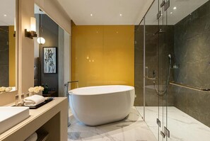 Suite, 1 King Bed, Non Smoking | Bathroom | Free toiletries, hair dryer, slippers, towels