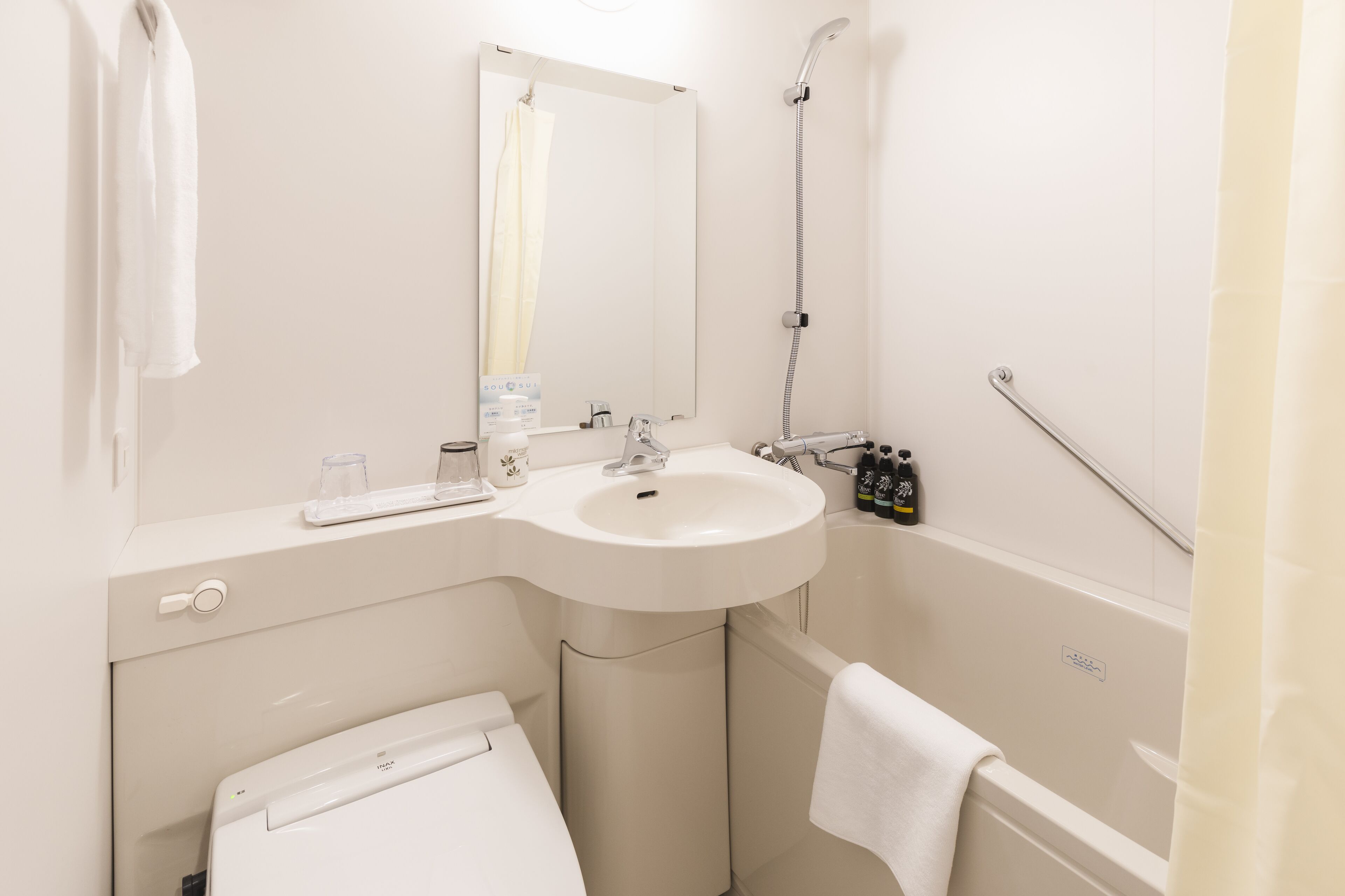 hair dryer, slippers, bidet, towels