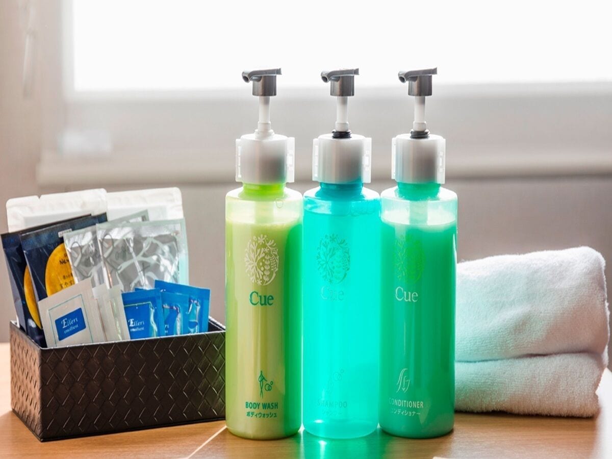 hair dryer, slippers, bidet, towels