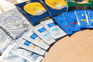 A variety of face wash products arranged on a table.