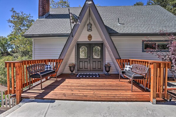 Stunning home with a charming gable roof, symmetrical porch, and cozy entrance.