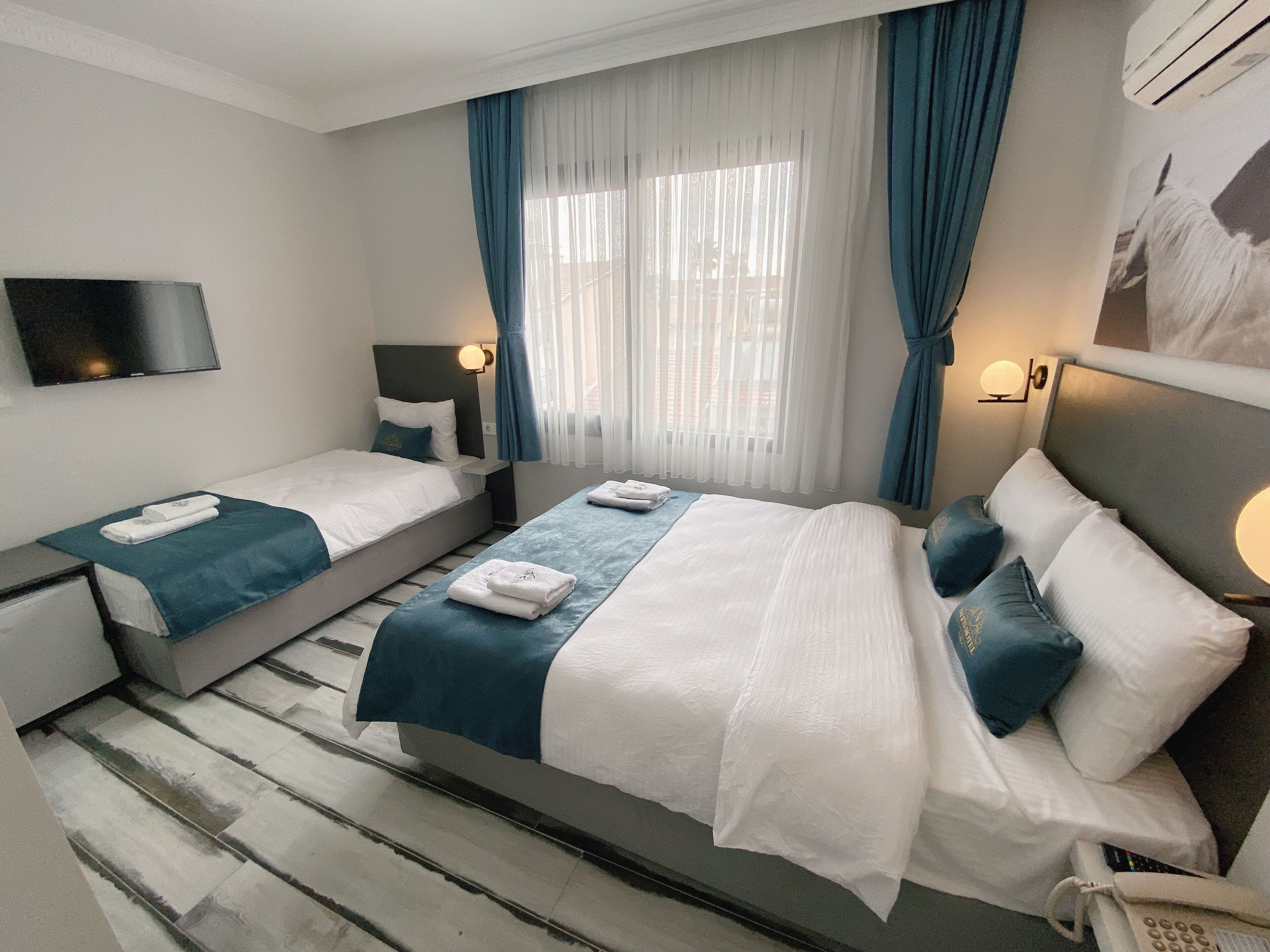 standard triple room | in-room safe, free wifi, bed sheets
