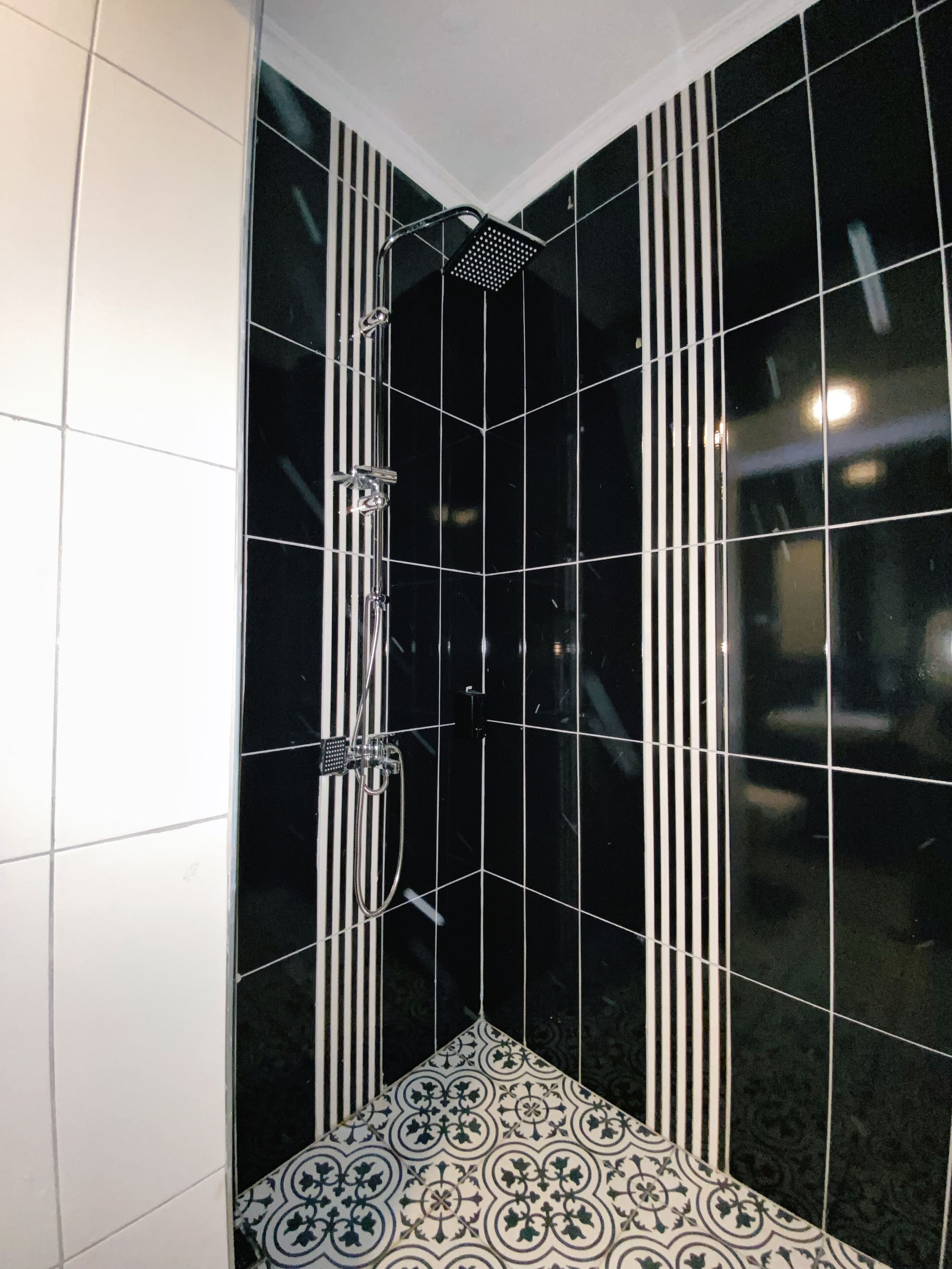 shower, hair dryer, slippers, towels