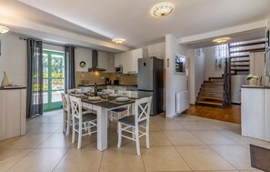 Fridge, stovetop, dishwasher, coffee/tea maker