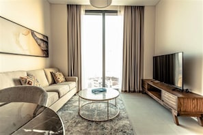 Apartment (1 Bedroom) | Living area | 0-cm plasma TV with satellite channels, TV