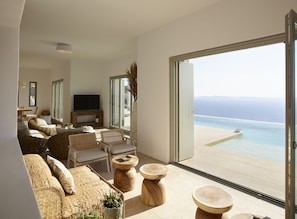 Luxury Villa, Multiple Bedrooms, Private Pool, Sea View | Living room | 25-inch flat-screen TV with satellite channels, TV - Absolute Paradise Villa Tourlos (Mykonos)