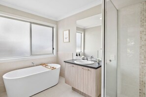 Bathtub, hair dryer, towels