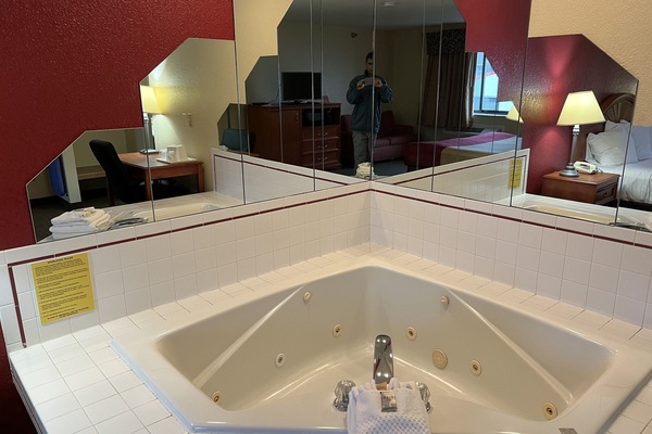 Bathtub, towels, soap, shampoo