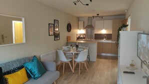 A modern apartment with a living room, dining area, and kitchen. - Fantastic Centrally Located 1 bed Apartment (Liverpool)