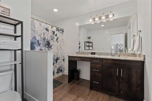 Combined shower/bathtub, hair dryer, towels, soap