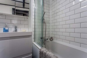 Combined shower/tub, hair dryer, towels, soap