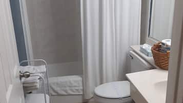 Bathtub, hair dryer, towels, soap