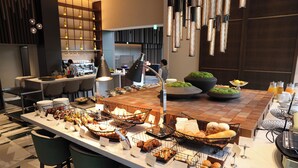 A buffet setup with various food items and a bar area. - Intercontinental Appi Kogen Resort by IHG (Hachimantai)
