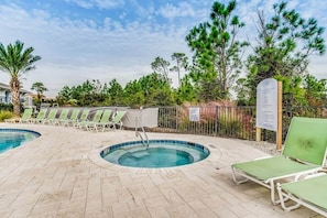 A pool area with lounge chairs, a hot tub, and a sign indicating no diving. - Paradise Found at Lost Key Resort: Tropical Bliss (Pensacola)