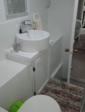 Shower, towels, soap, toilet paper