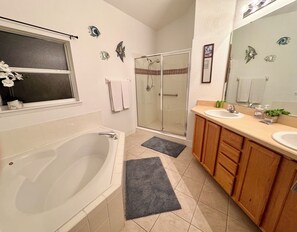 Bathtub, towels, soap, toilet paper