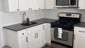 Microwave, coffee/tea maker, electric kettle, dining tables