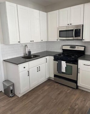 Microwave, coffee/tea maker, electric kettle, dining tables