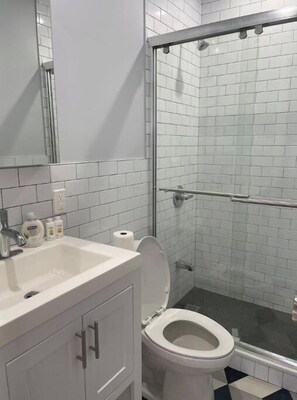 Combined shower/tub, hair dryer, towels, soap