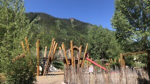 A playground with wooden structures and a no dogs allowed sign. - Newly Renovated, 3 bd, 3 bath on shuttle route (Vail)