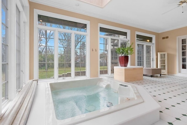 Awesome large room right off the kitchen and living room with built-in five-person hot tub.