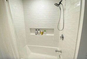 Combined shower/tub, hair dryer, towels, soap