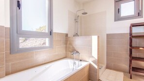 Bathtub, hair dryer, towels